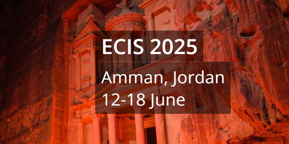 Red illuminated building with ECIS 2025 as text in front of it