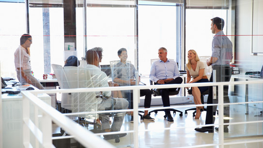 meeting situation 02 six people sitting together in a bright room are facing each other